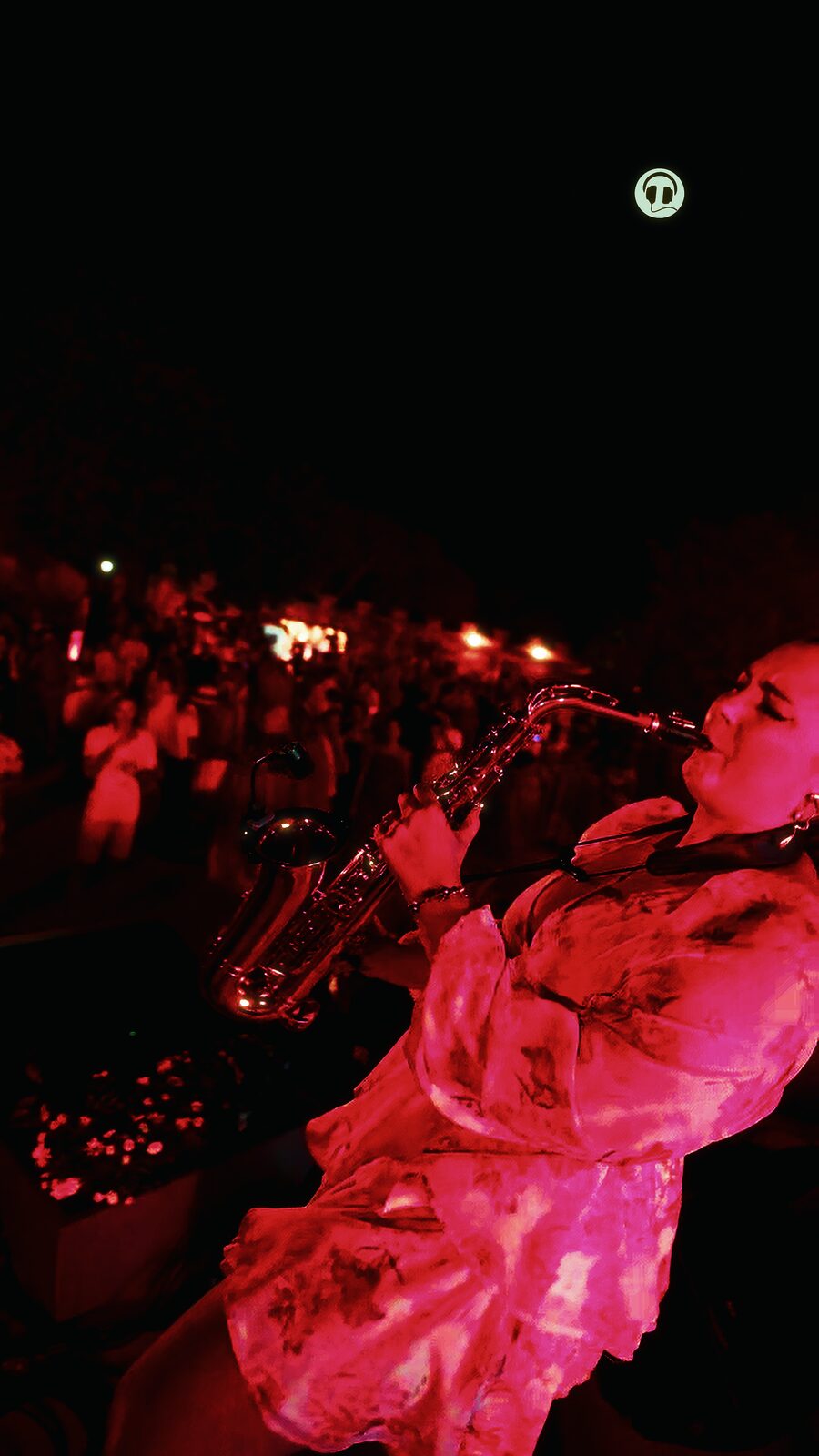 Saxophonist playing alongside the DJ