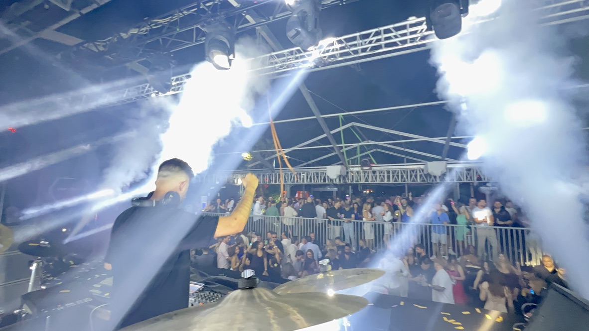 CO2 jets firing over a packed club floor