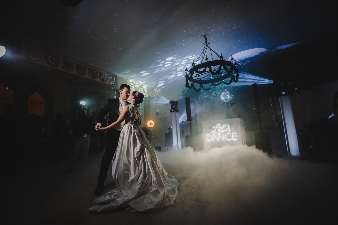 First dance on a cloud of low fog beneath the Let’s Dance sign