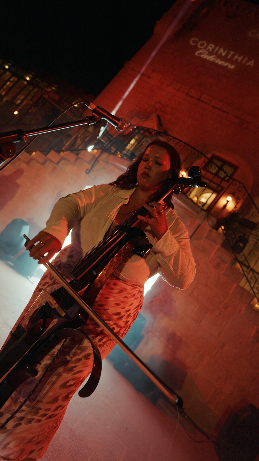 Saxophonist pointing to the crowd under a laser beam at Castello Zamittello