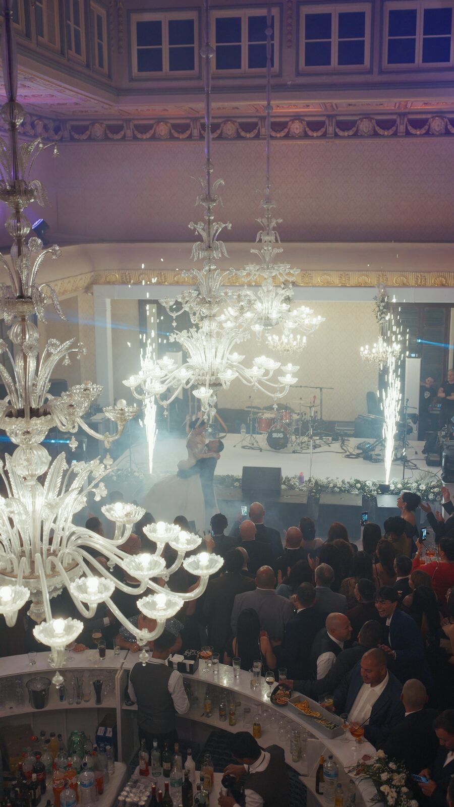 Couple dancing surrounded by guests