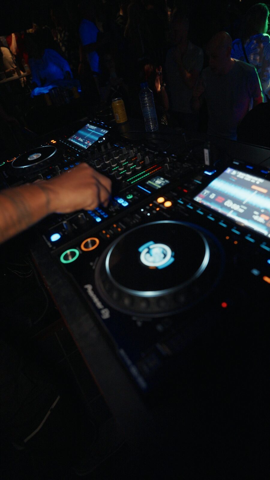 Pioneer decks lit up mid set with the crowd close behind