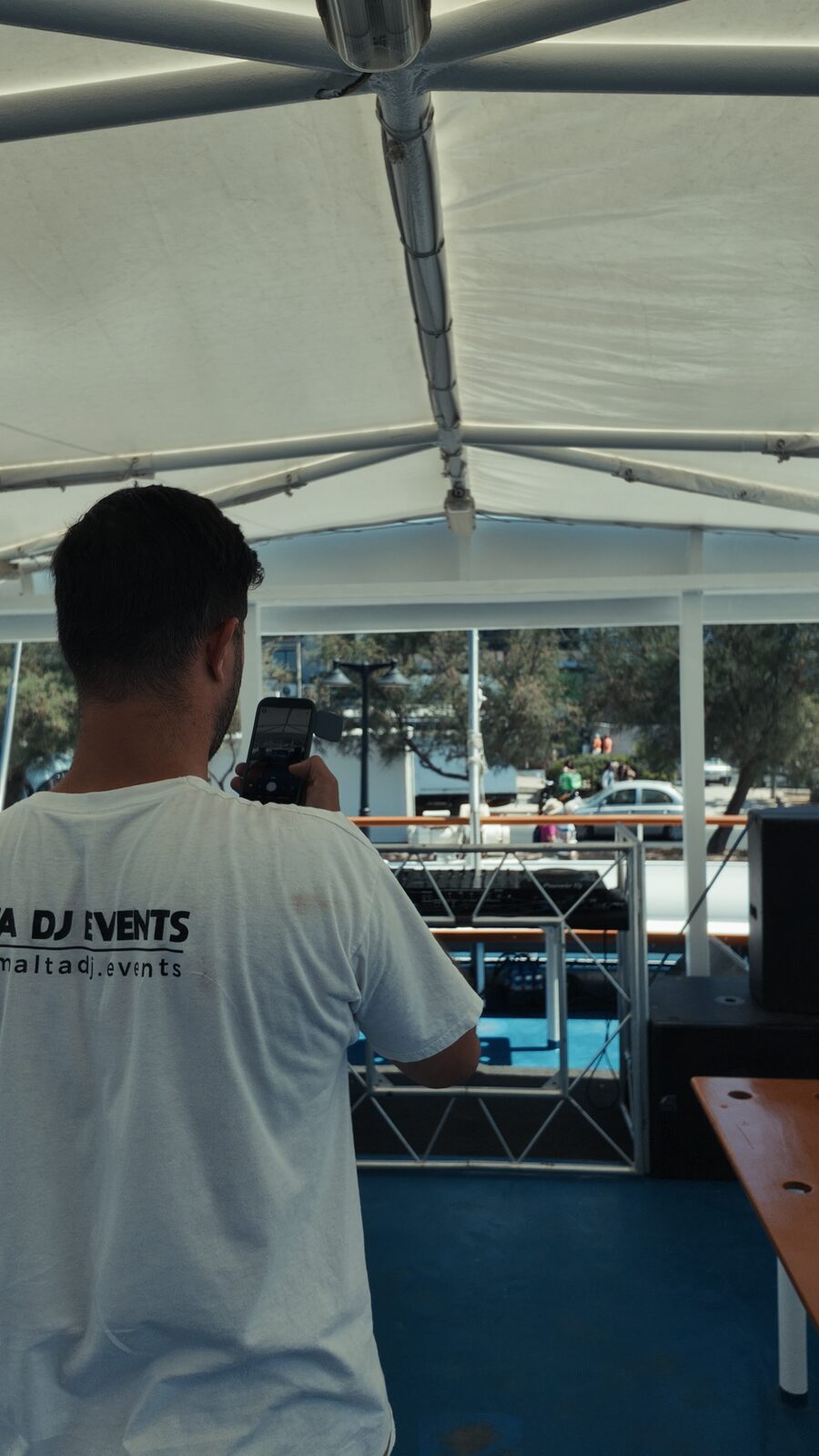 Crew filming the boat setup before guests board