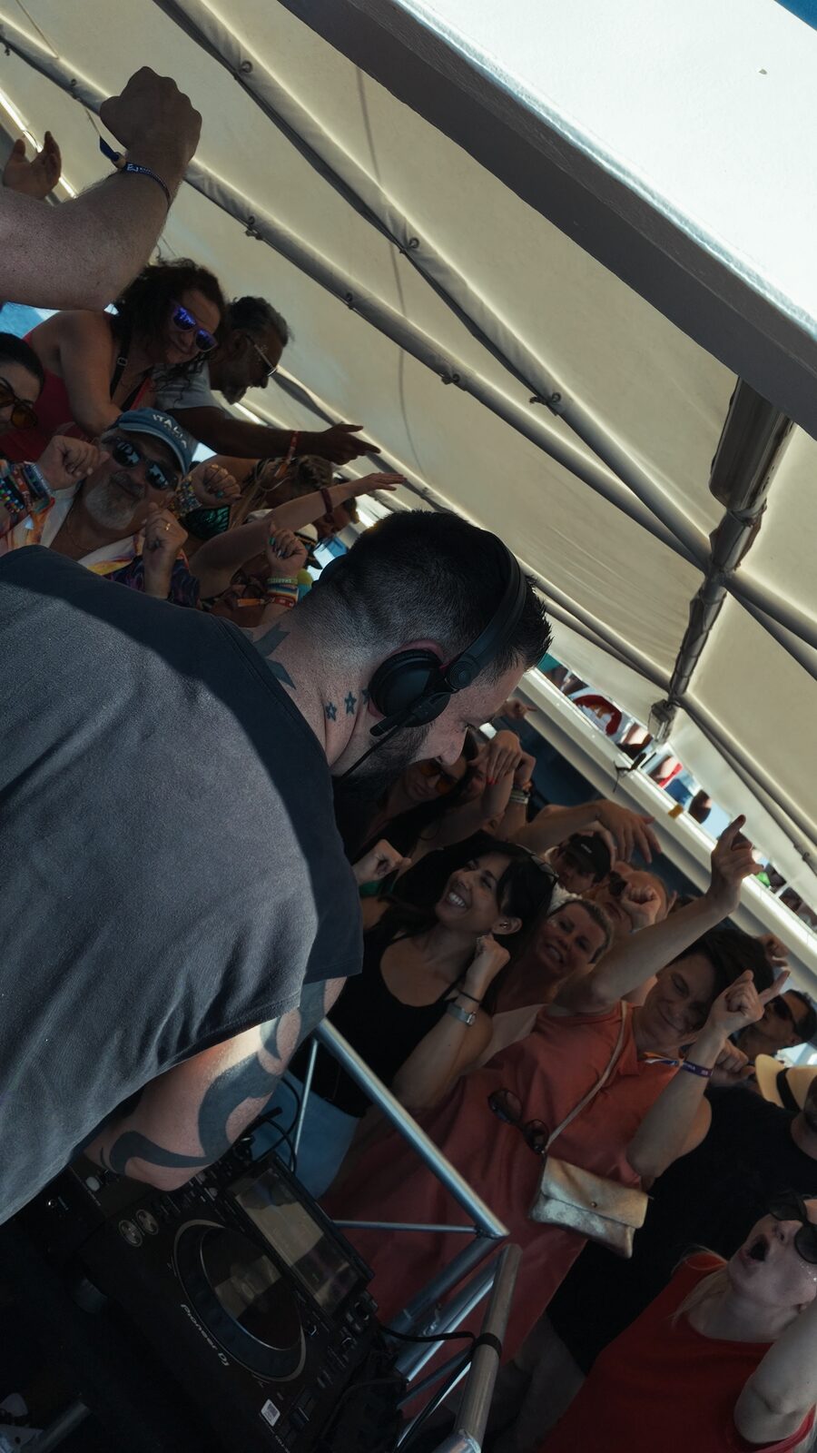 Hands in the air on the boat party