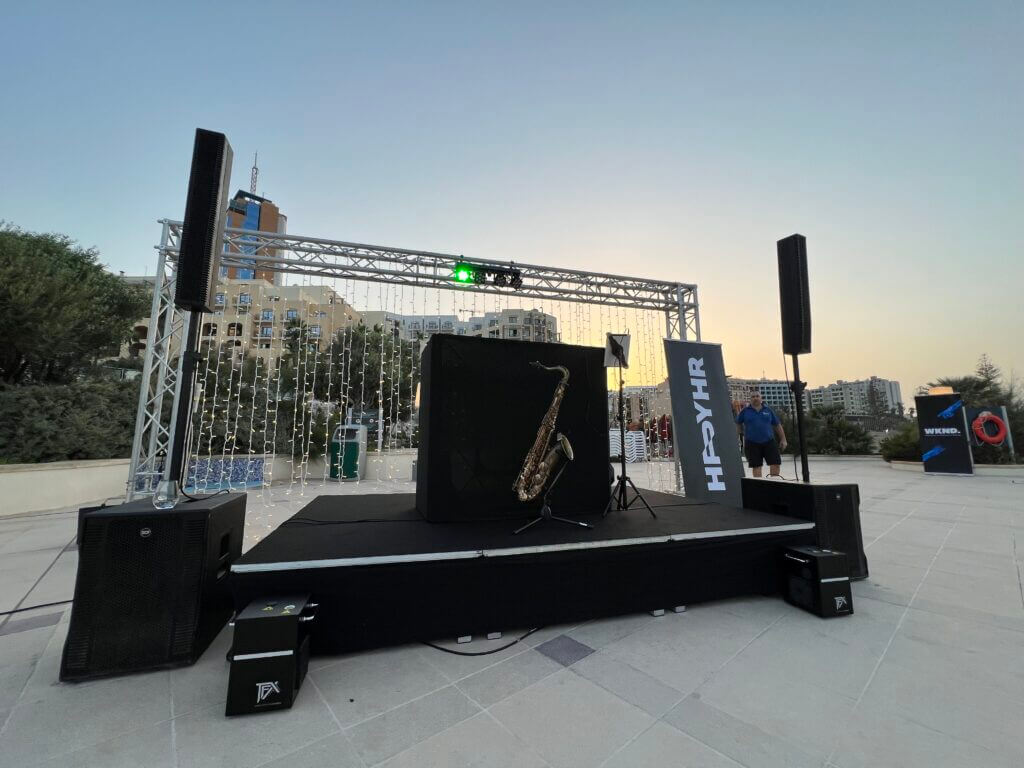 Package F - DJ, Saxophonist, Truss behind DJ with fairy lights, Stage, x2 highs x2 subs speaker system, x2 moving heads, x5 uplighters, x1 wireless microphone,, DJ Stand, Pioneer DJ Equipment x2 cold fountains 
